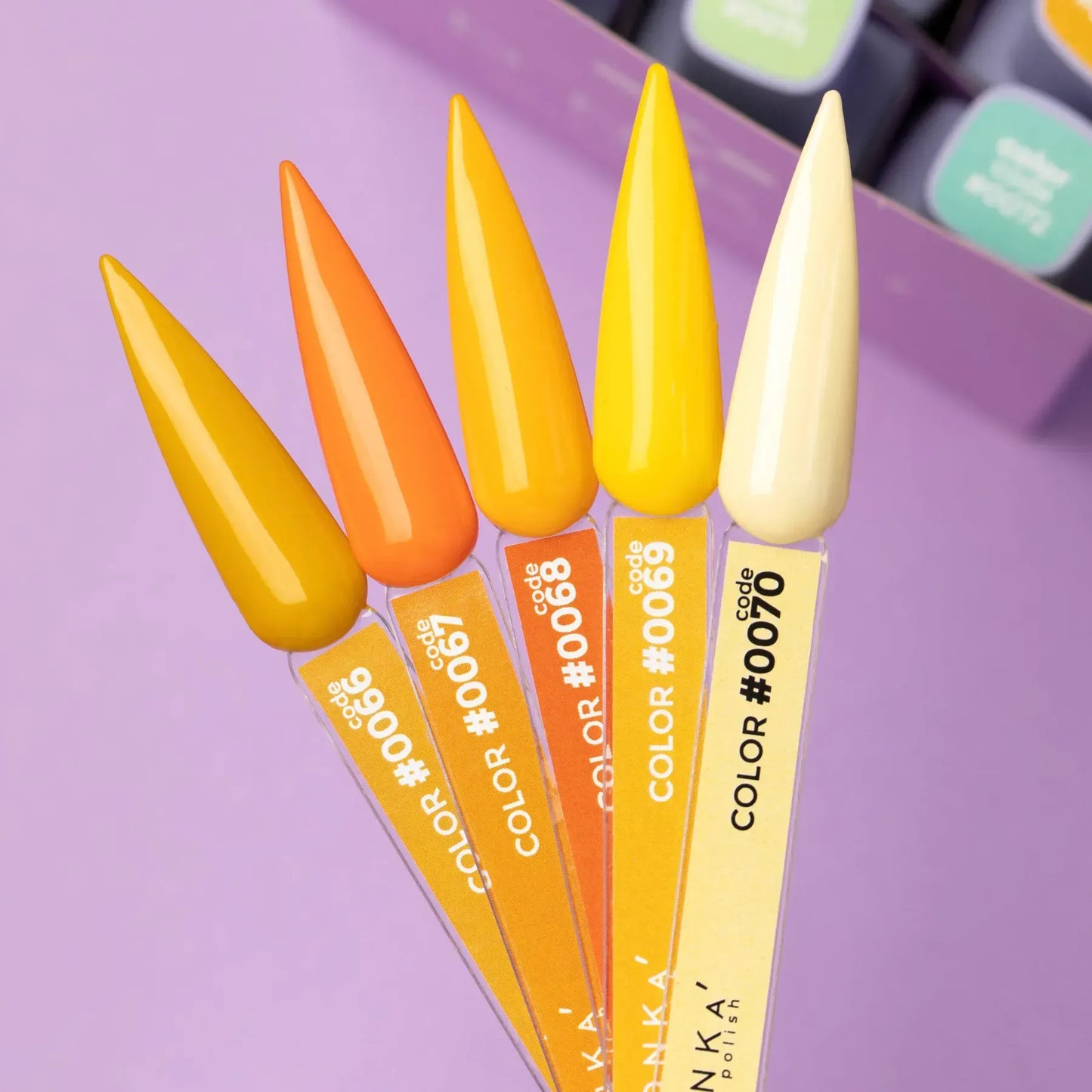 Five DNKa' gel polish swatches displaying colors #0066 through #0070—a gradient ranging from orange to yellow—against a purple background.
