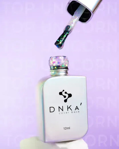 Close-up of DNKa Top Unicorn multicolor glitter effect on nail tip